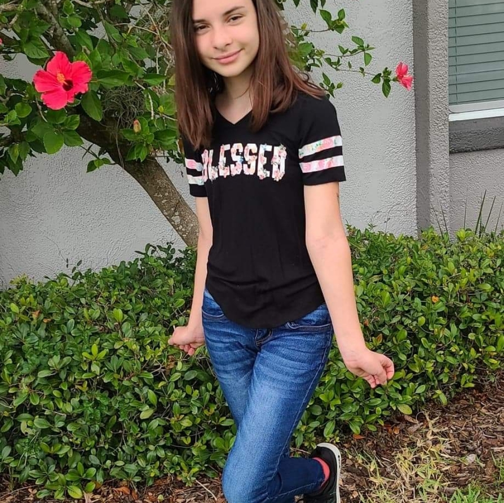 Black shirt with blessed lettering and stripes